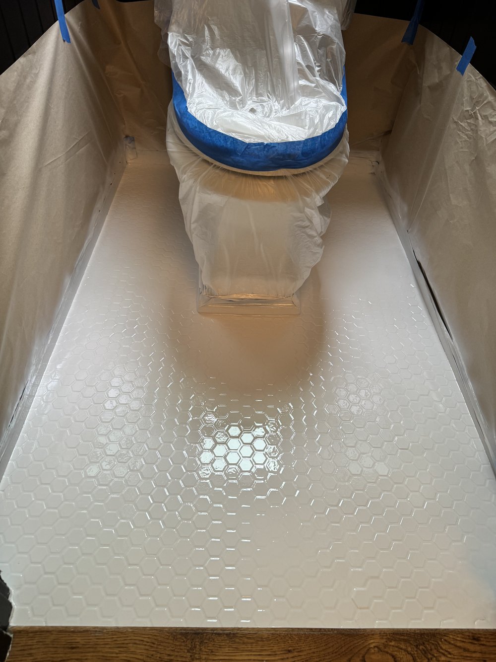 Tile floor reglazing &mdash; Floor degreased, masked, and spray-coated in progress &mdash; Belmont, CA