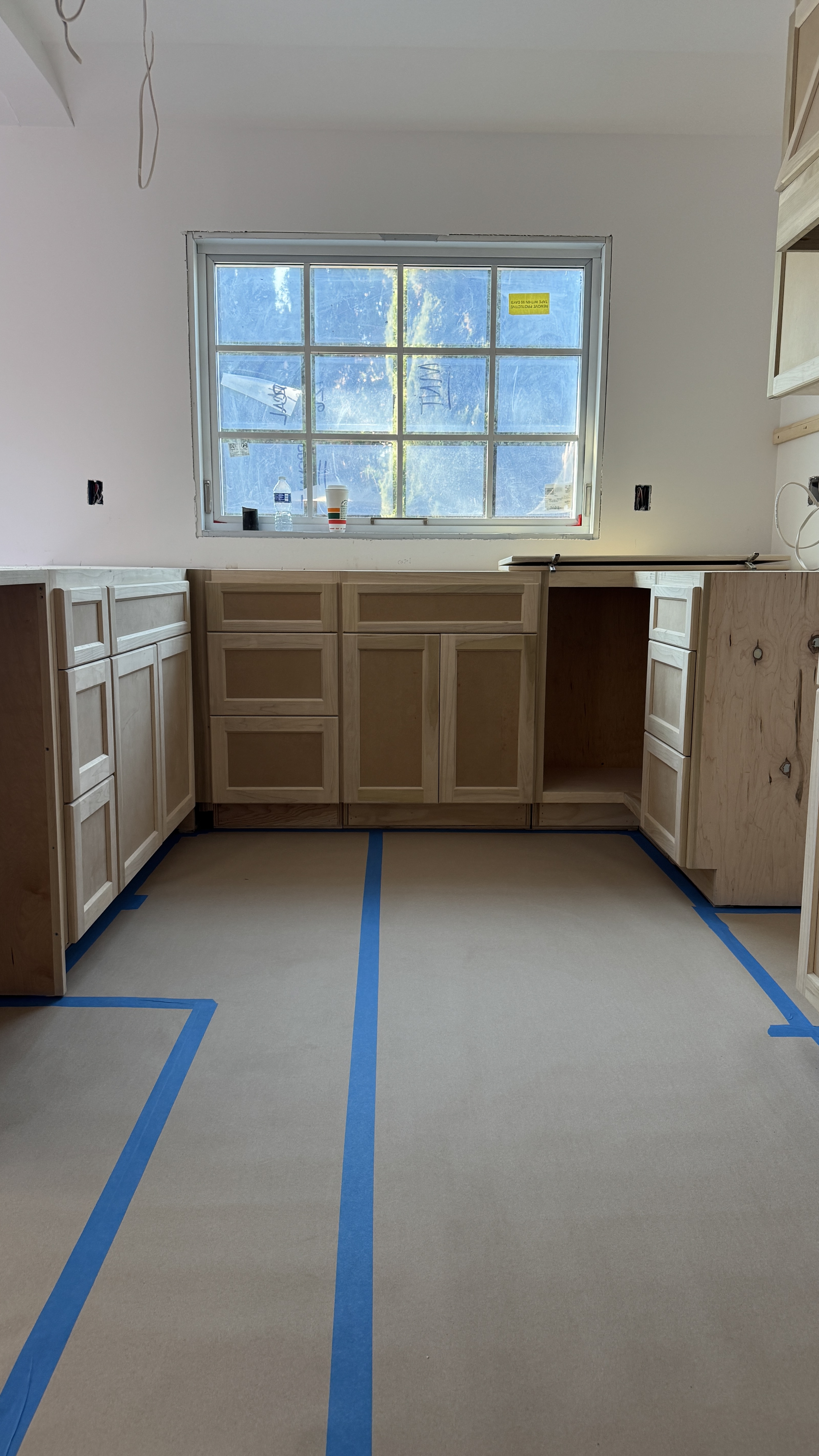 Kitchen cabinet installation &mdash; Shaker boxes laid out and aligned on site before finishing &mdash; Saratoga, CA