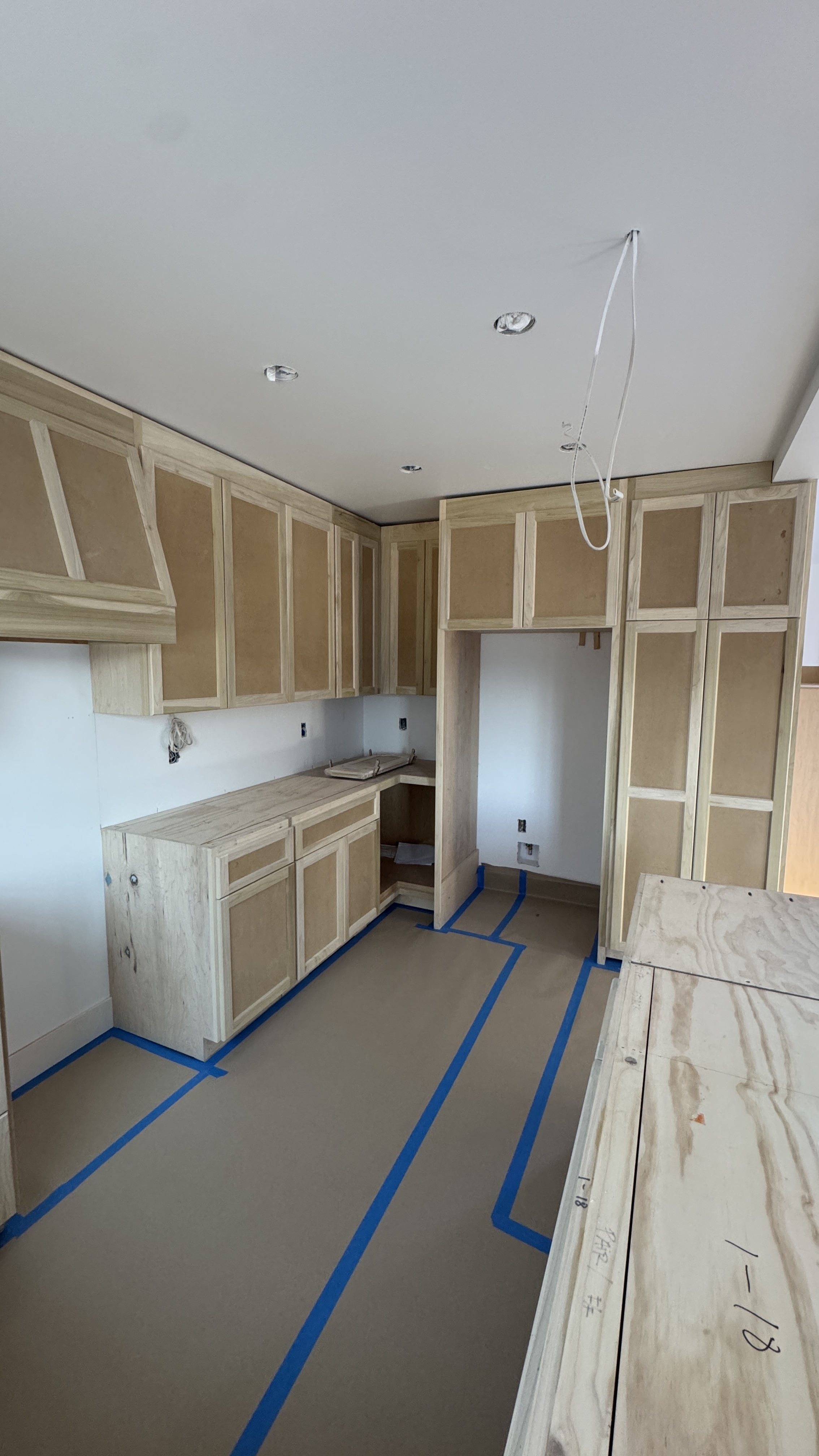 Kitchen cabinet installation &mdash; Base run and island boxes installed during build-out &mdash; Saratoga, CA