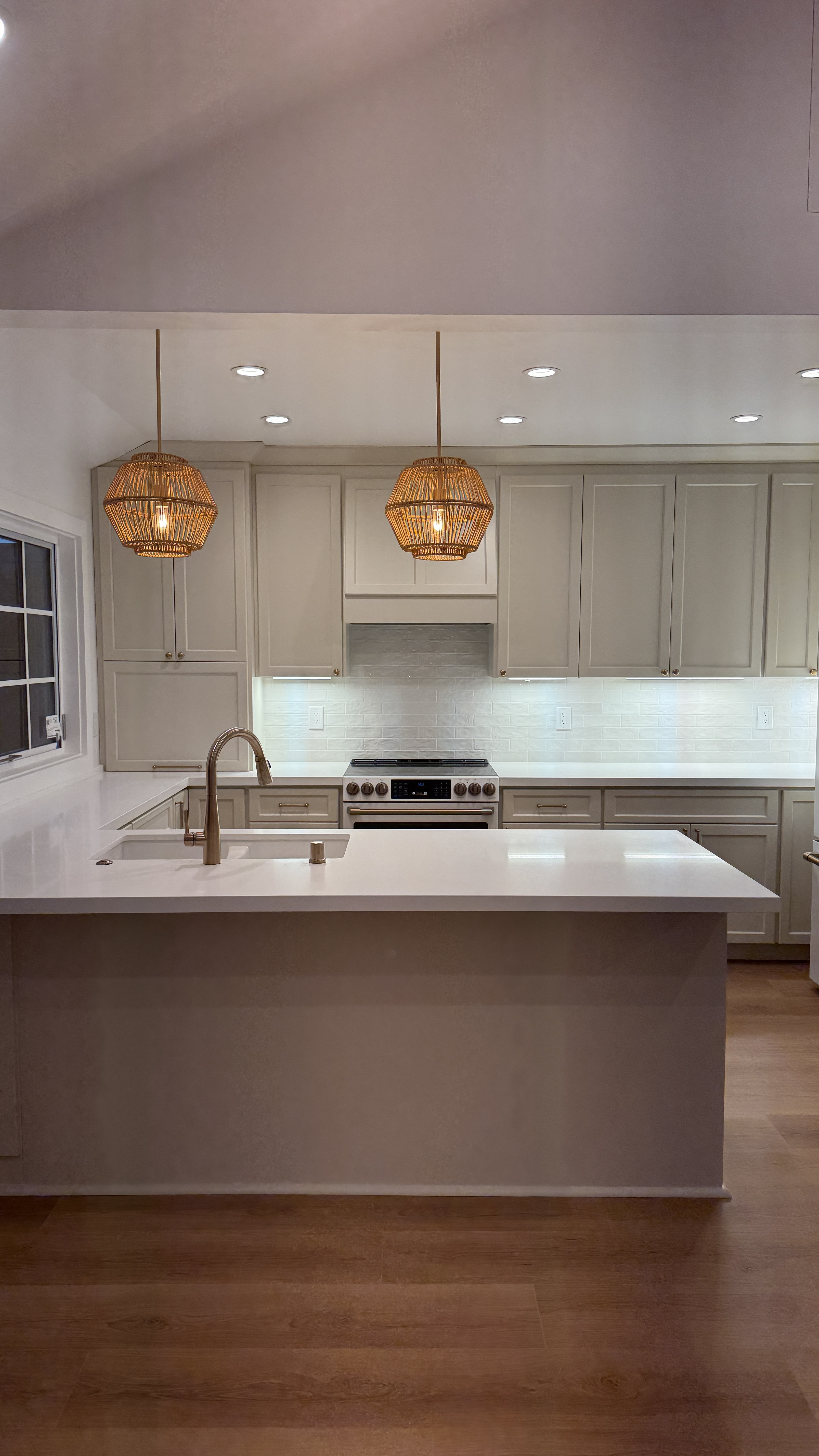 Kitchen cabinet refinishing &mdash; Completed refinish with island, pendants, and hardware installed &mdash; Saratoga, CA