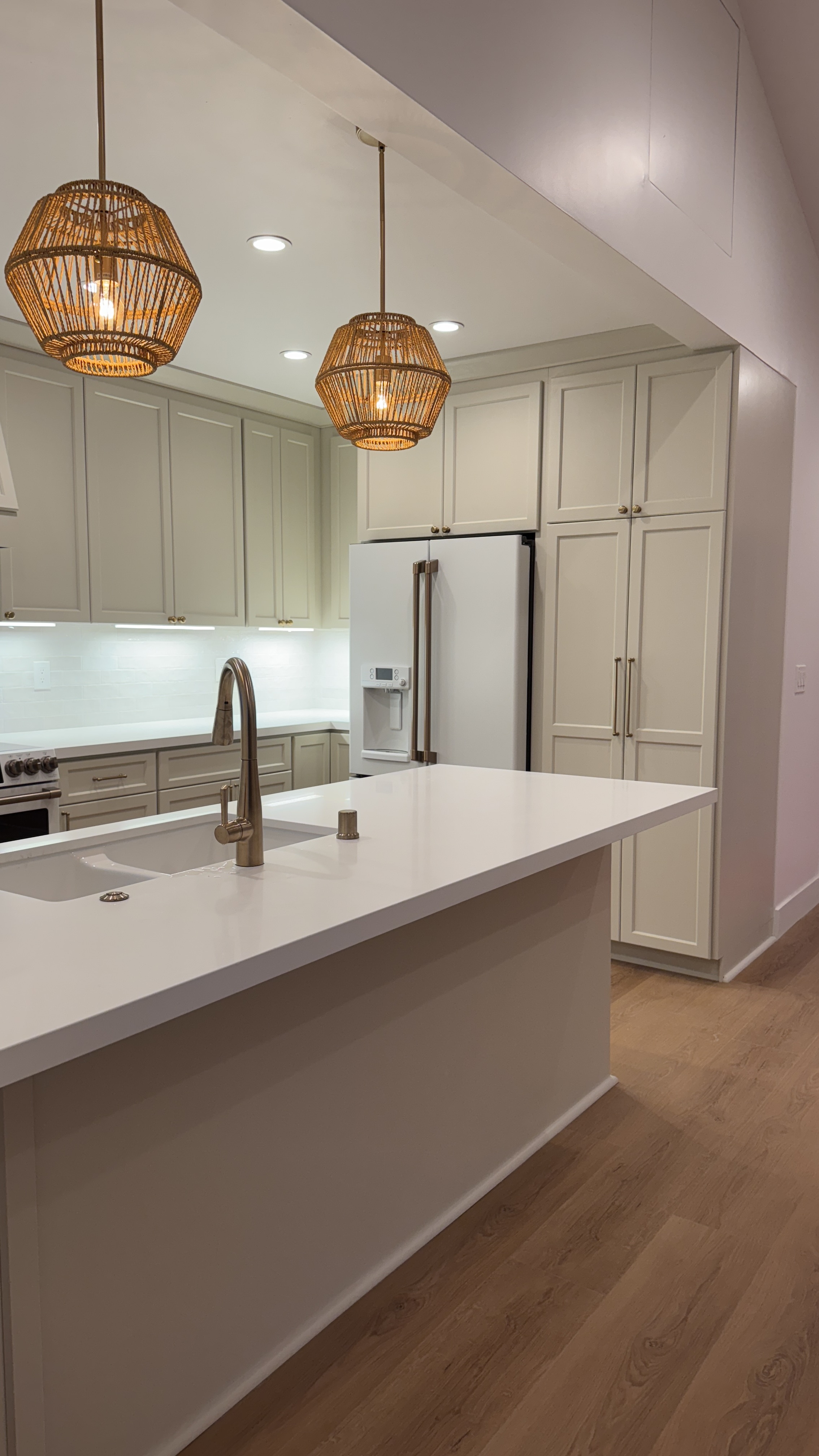 Kitchen cabinet refinishing &mdash; Finished shaker detail with hardware set and floors protected &mdash; Saratoga, CA