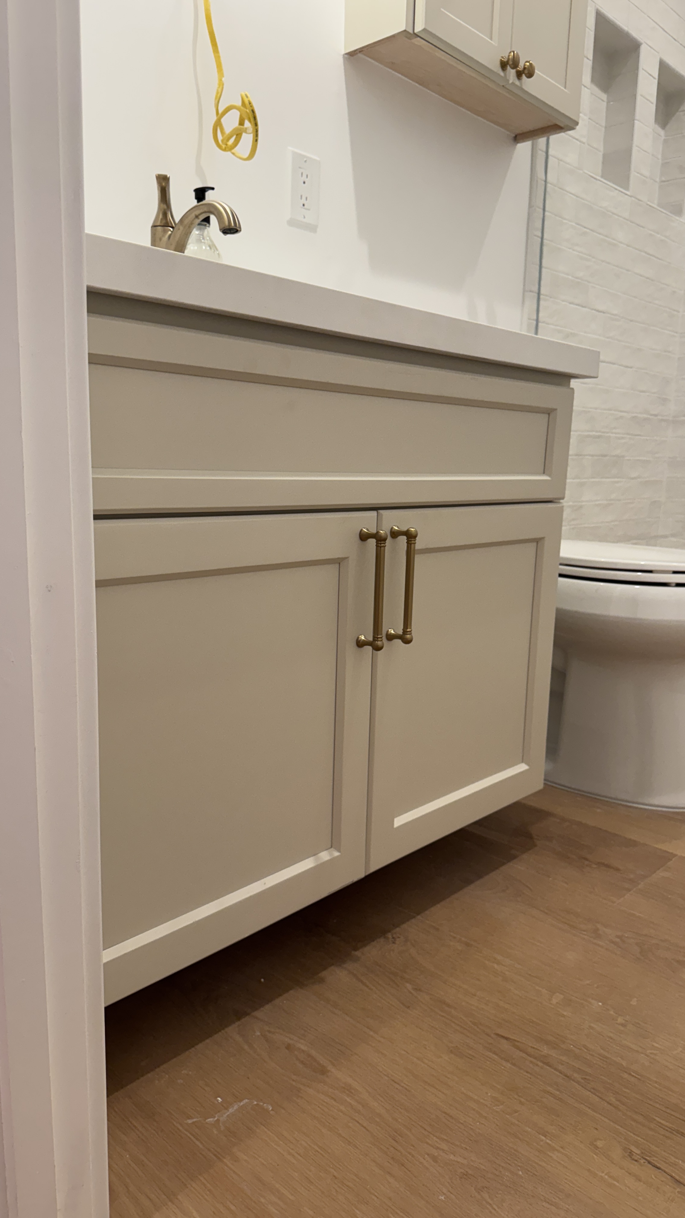 Bathroom cabinet refinishing &mdash; Finished wall-mounted cabinet with crown detail installed &mdash; Saratoga, CA