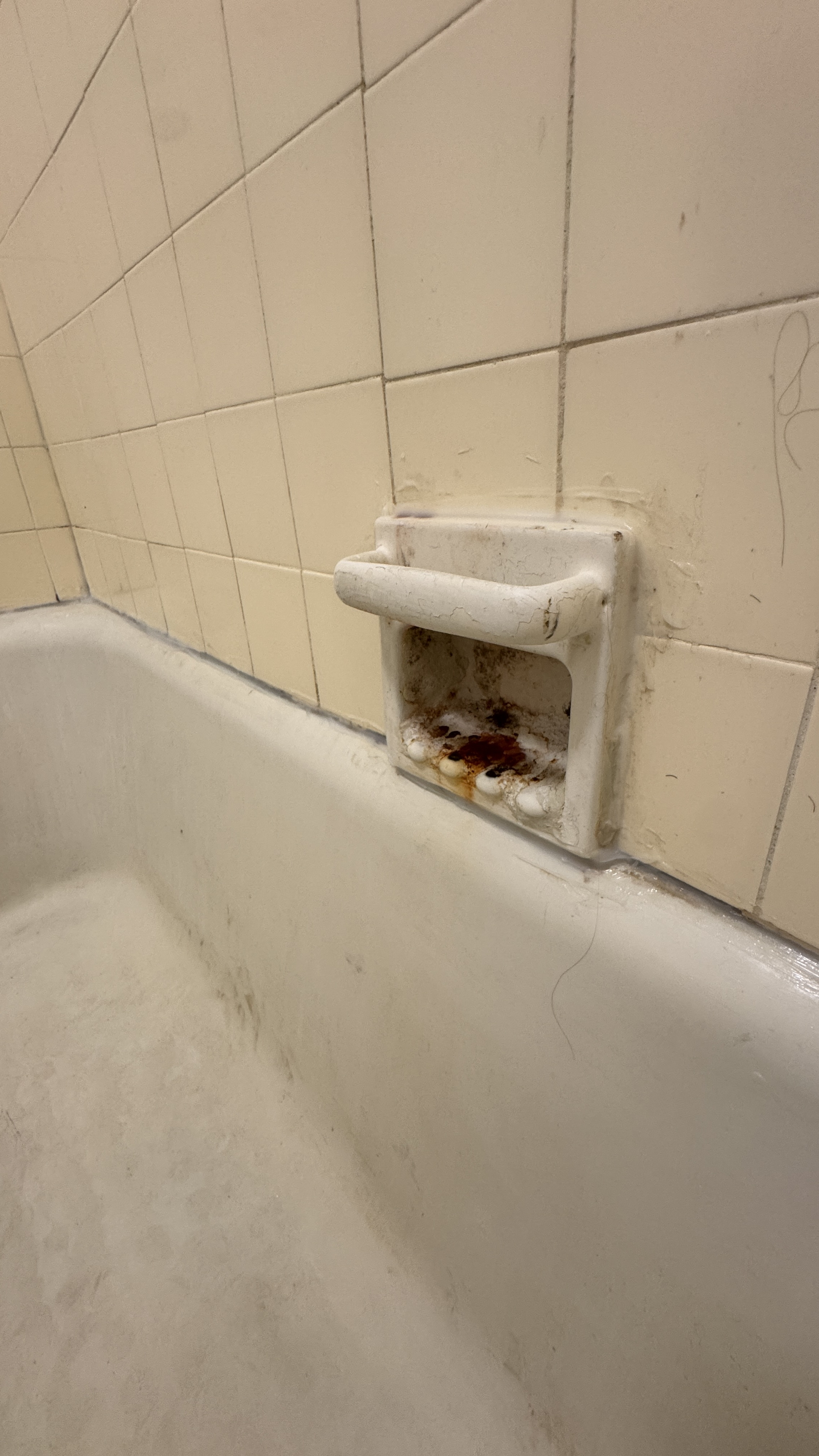 Bathtub reglazing &mdash; Worn surround and fixtures documented before reglazing &mdash; Daly City, CA