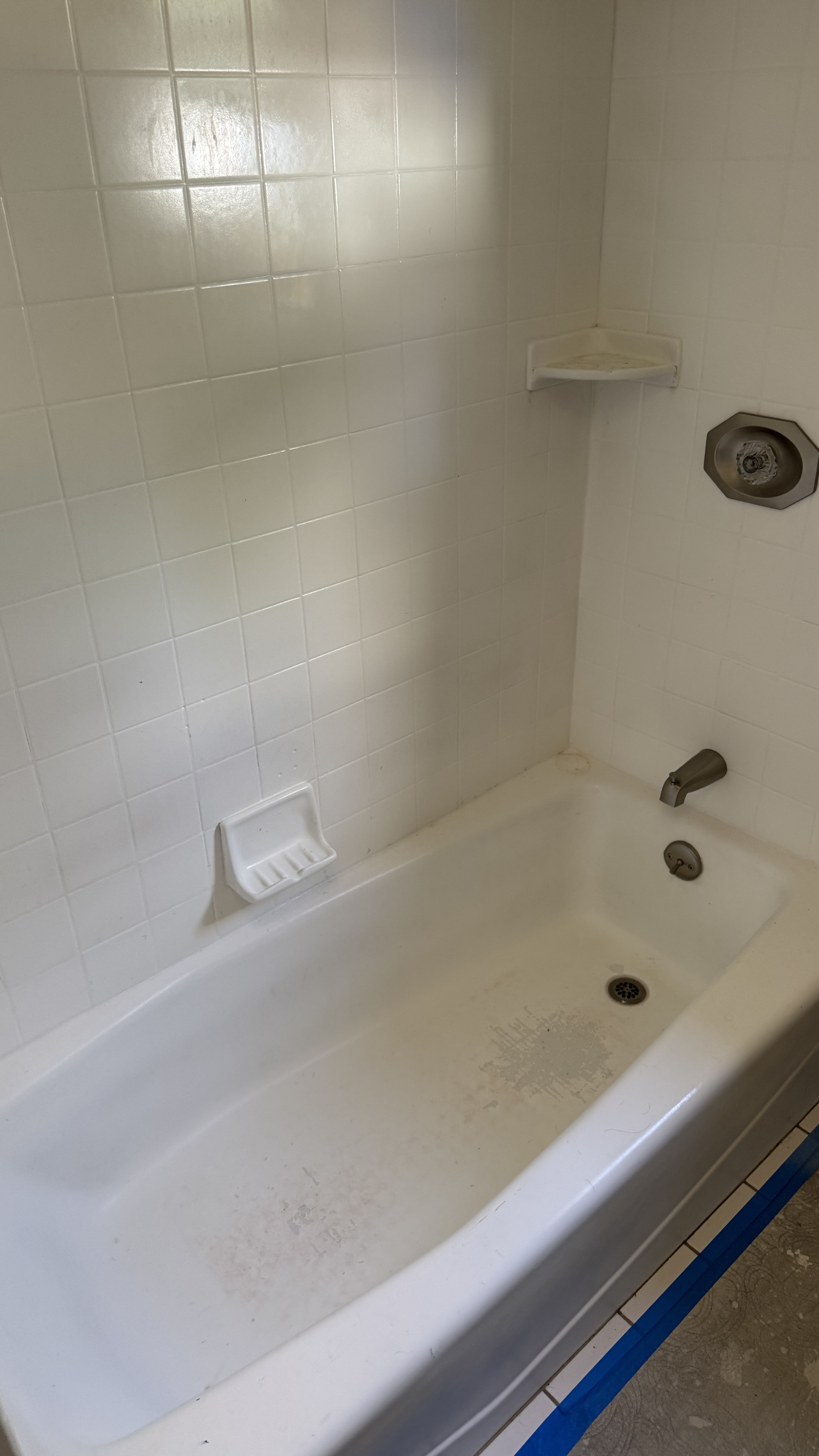 Bathtub reglazing &mdash; Peeling finish on tub floor noted before restoration &mdash; Oakland, CA