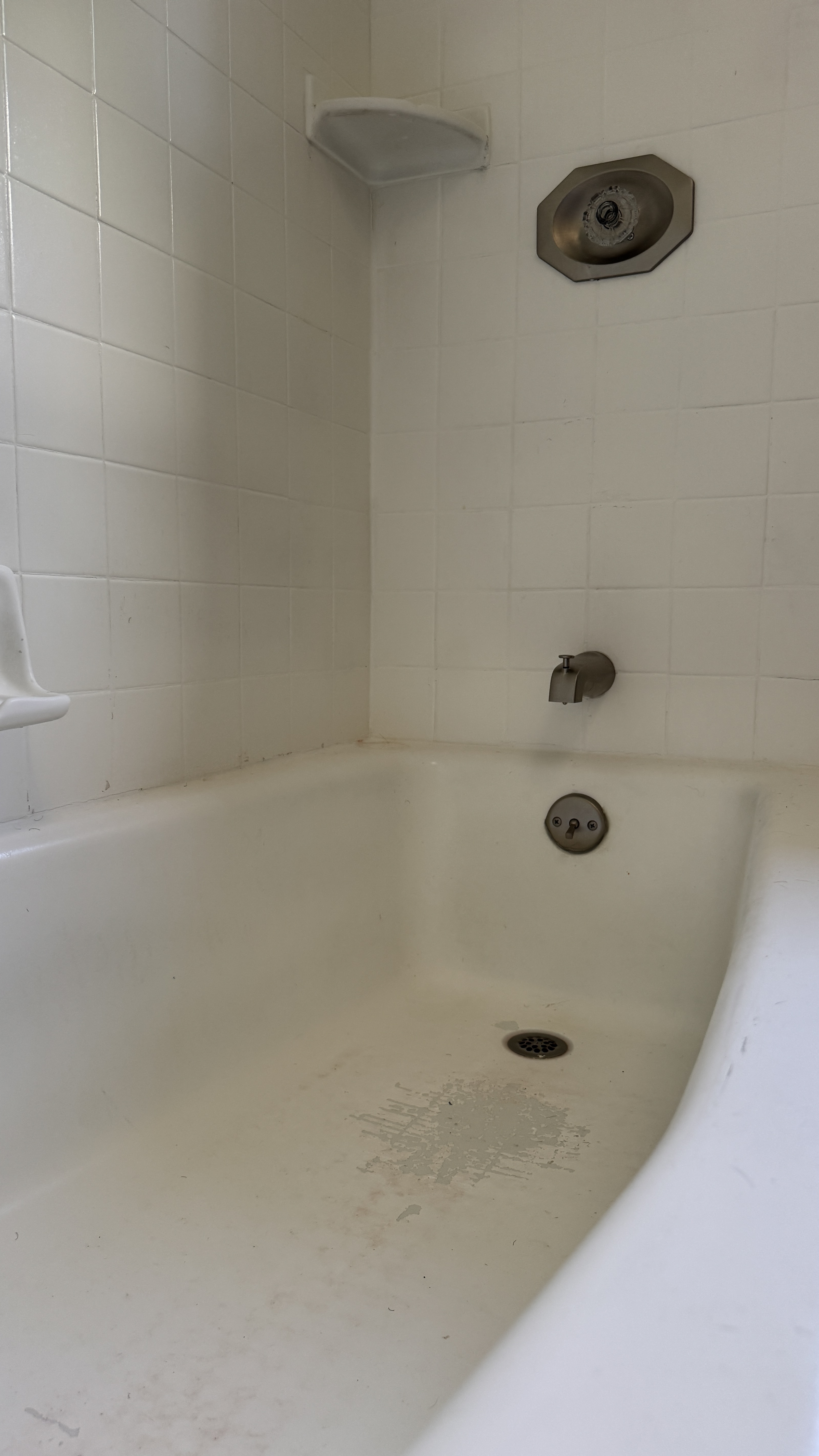 Bathtub reglazing &mdash; Tub interior prepped with fixtures taped off &mdash; Oakland, CA