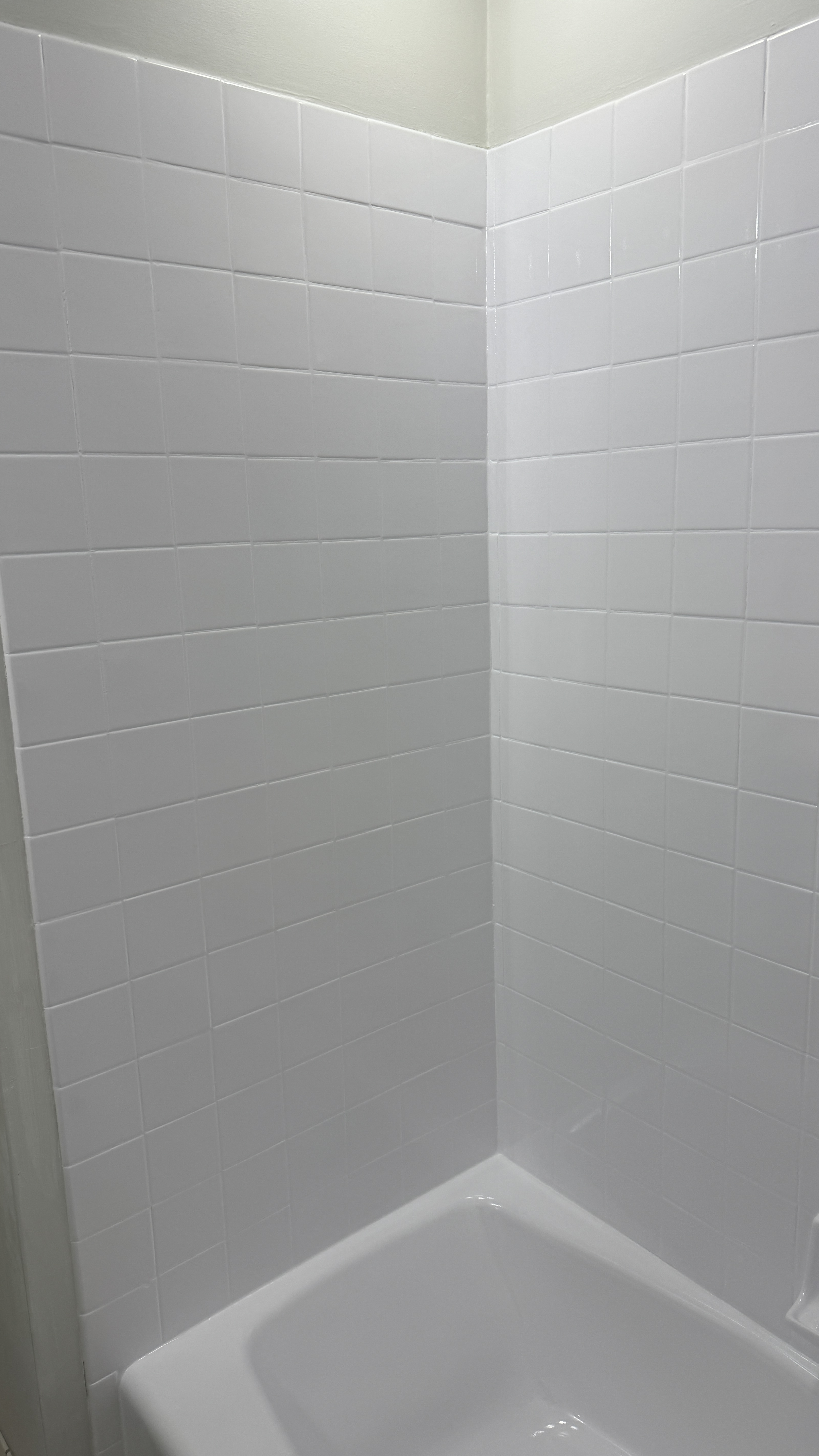 Bathtub reglazing &mdash; Tub and tile walls fully masked before spray application &mdash; Oakland, CA