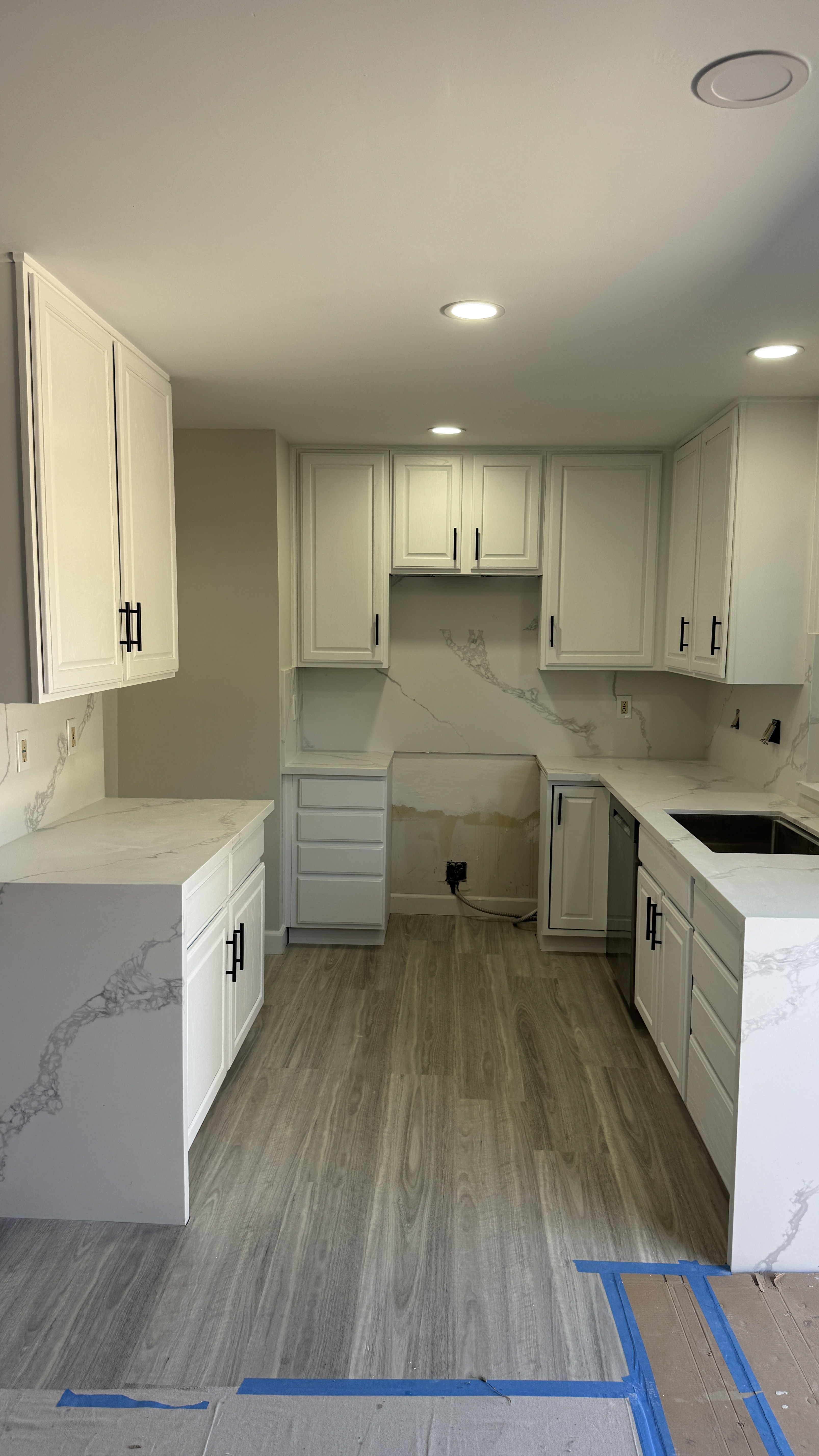 After in Walnut Creek, CA &mdash; white shaker cabinets with quartz counters and new backsplash