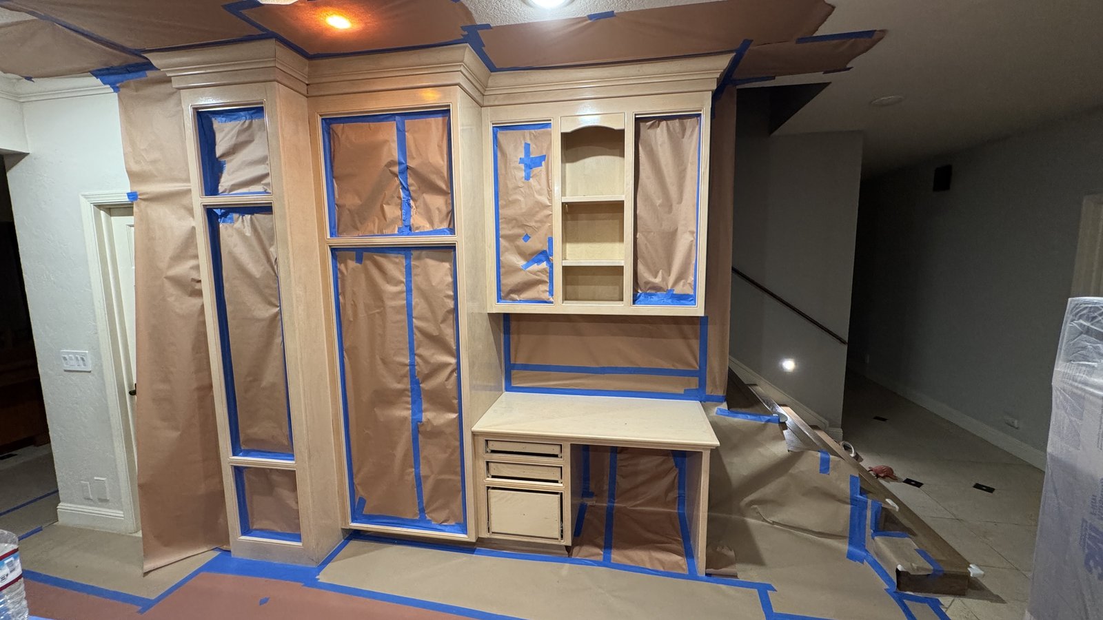 Kitchen cabinet refinishing &mdash; Built-in desk hutch and cabinets masked and prepped for spray finishing &mdash; Los Gatos, CA