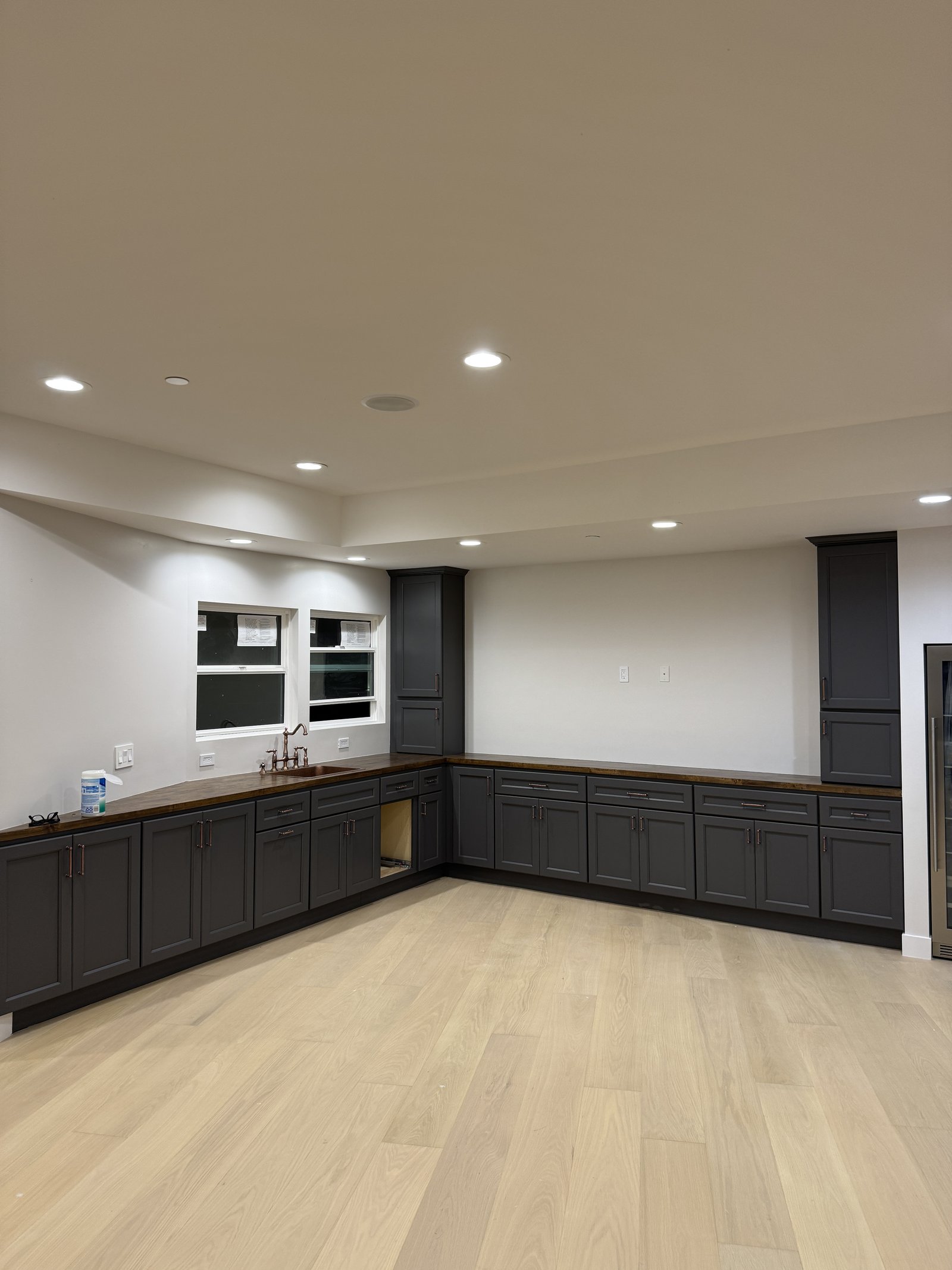 Kitchen cabinet installation &mdash; Dark shaker boxes set on site with counters staged &mdash; Santa Clara, CA